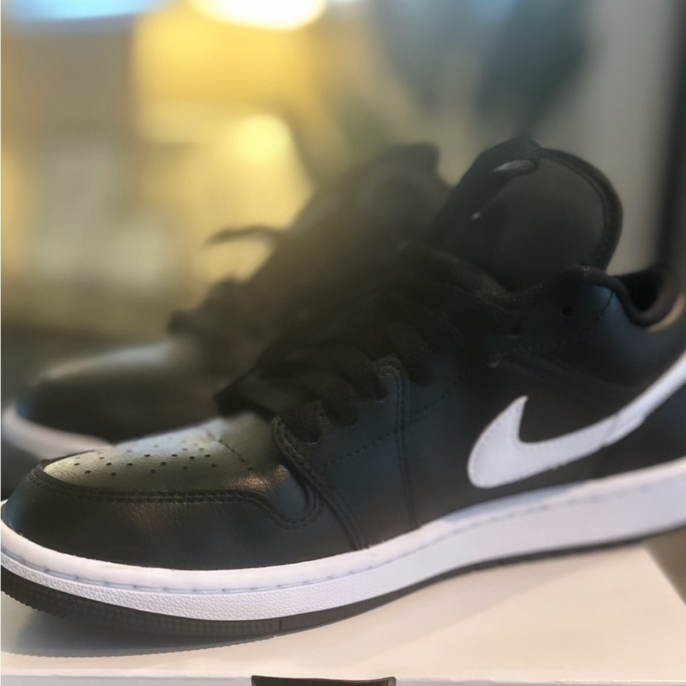 Air Jordan 1 Low. Women’s Size 9/Men’s Size 7.5 Black/Black/White.